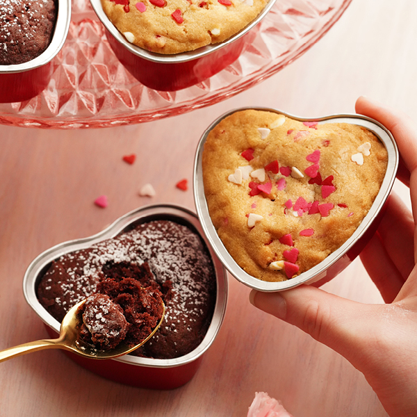4 mini heart shaped cookie pies in a box, two are red velvet, two are heart sprinkle